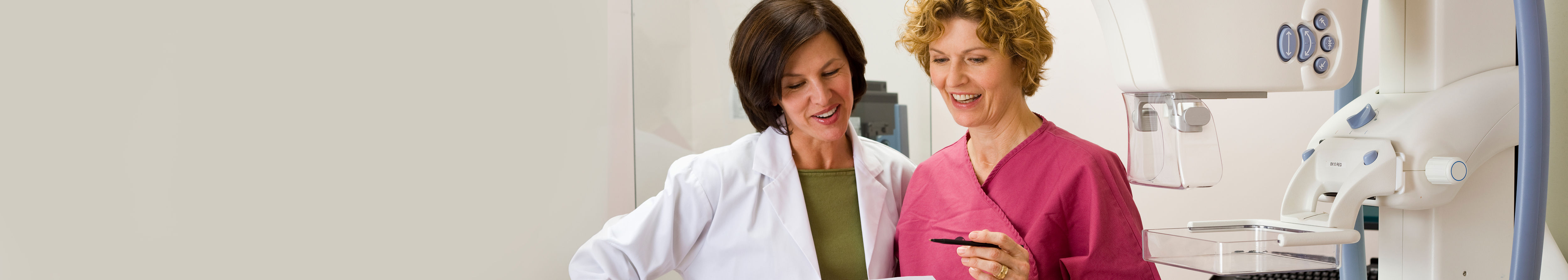 Two health care professionals in a radiology lab.